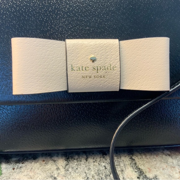 BUY IT NOW. NWOT, Kate Spade Robinson Street Crossbody Handbag Black/cream bow. - Picture 4 of 10